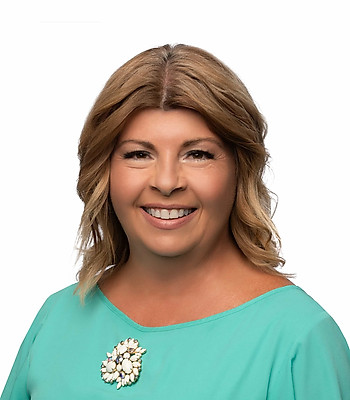 Portrait of Clare Merrick, REALTOR®.